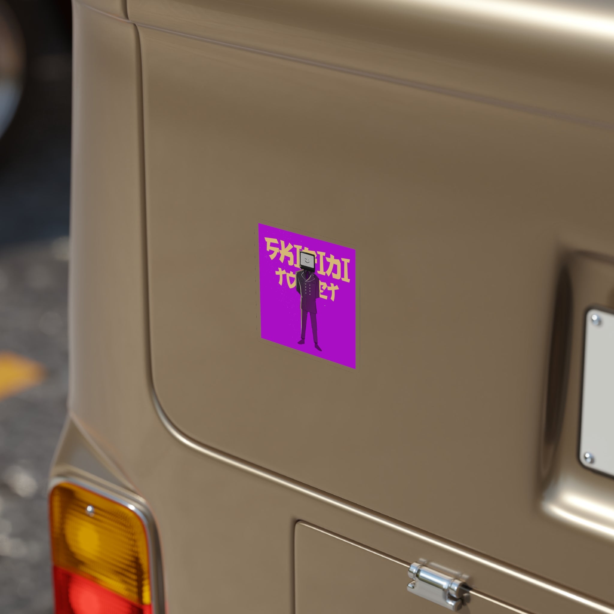 Purple sticker with Skibidi Toilet’s winking TV Man on gold van