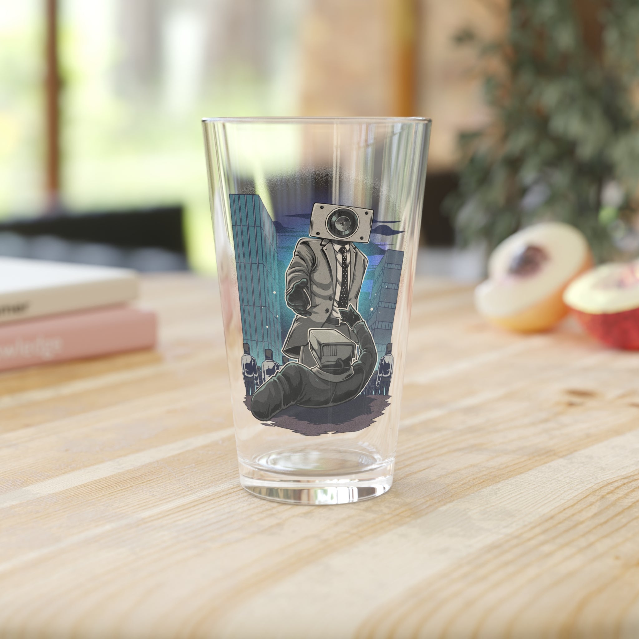Speakerman offering hand pint glass on a wooden counter with fruit and books
