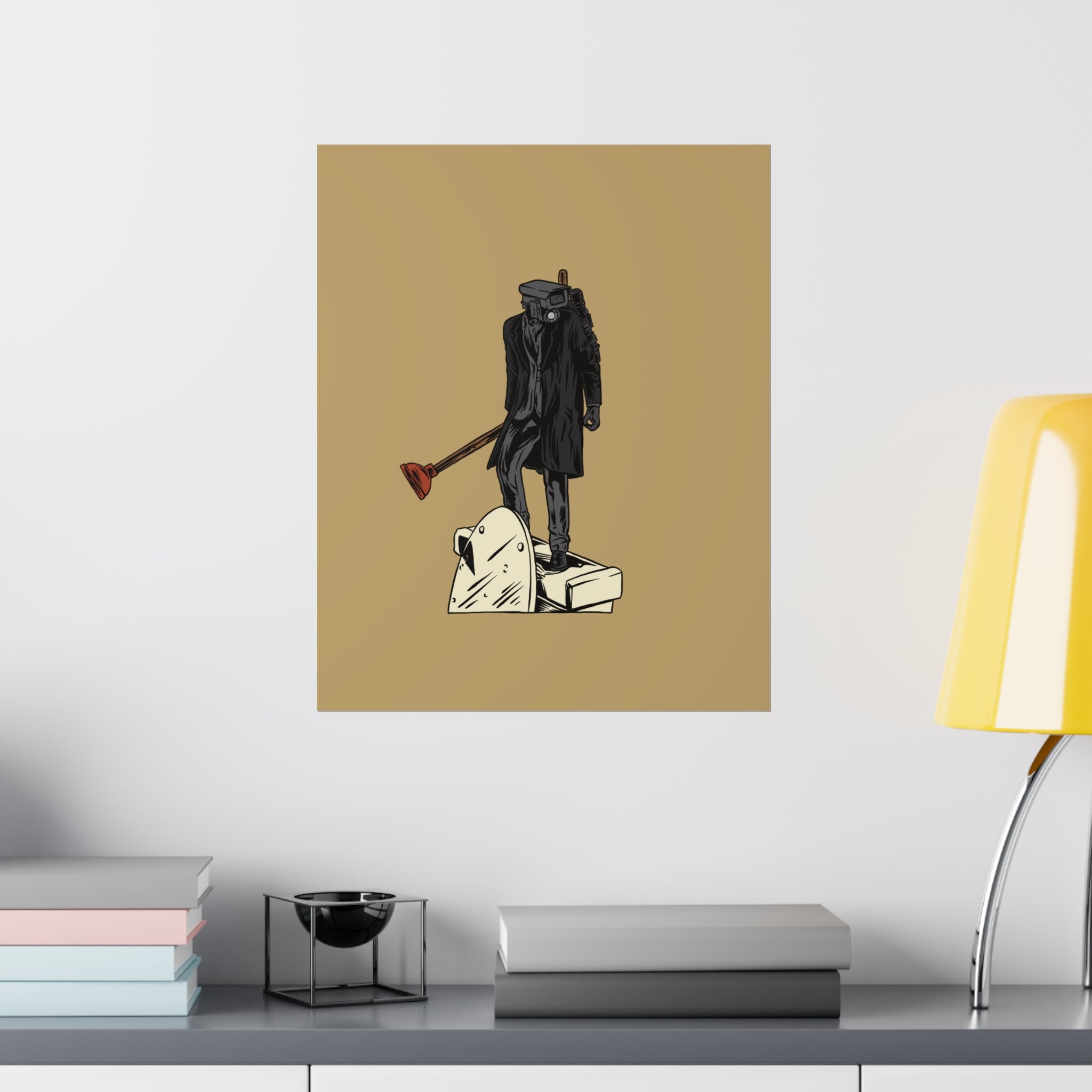 Plungerman on tan matte poster hung over credenza with lamp and books