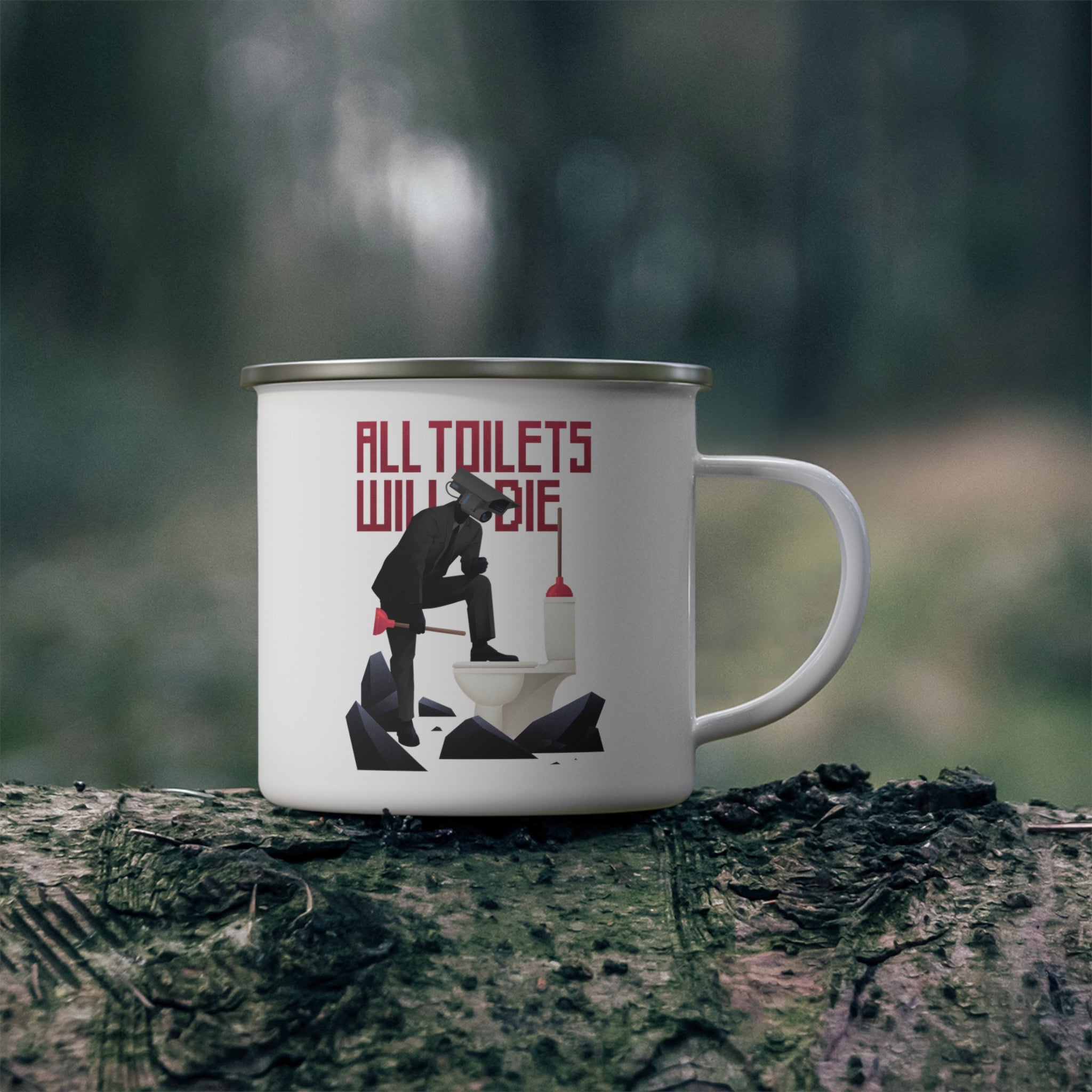 picture of white camping mug featuring an image of plungerman stepping on toilet mug. mug is on a log in nature